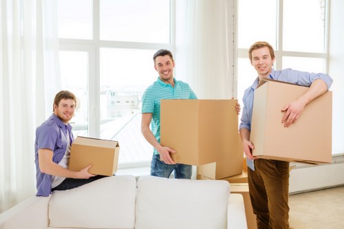 Furniture pick-up team handling a sofa and wardrobe in Portugal