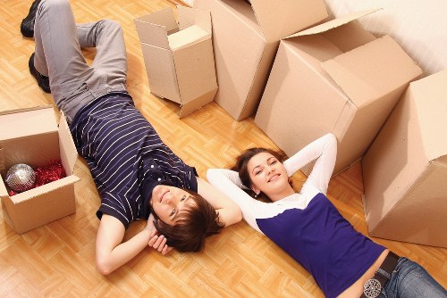 Local movers loading furniture in a Portuguese city street