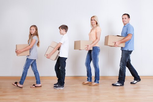 Furniture and boxes being loaded into a removals van in Portugal
