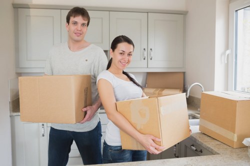 Furniture and boxes being moved from a Portuguese home with parking considerations